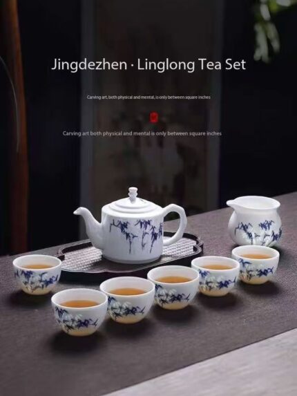 Home high end intricately carved ceramic hand painted jingdezhen blue and white delicate tea set, including a tea pot and tea cups.
